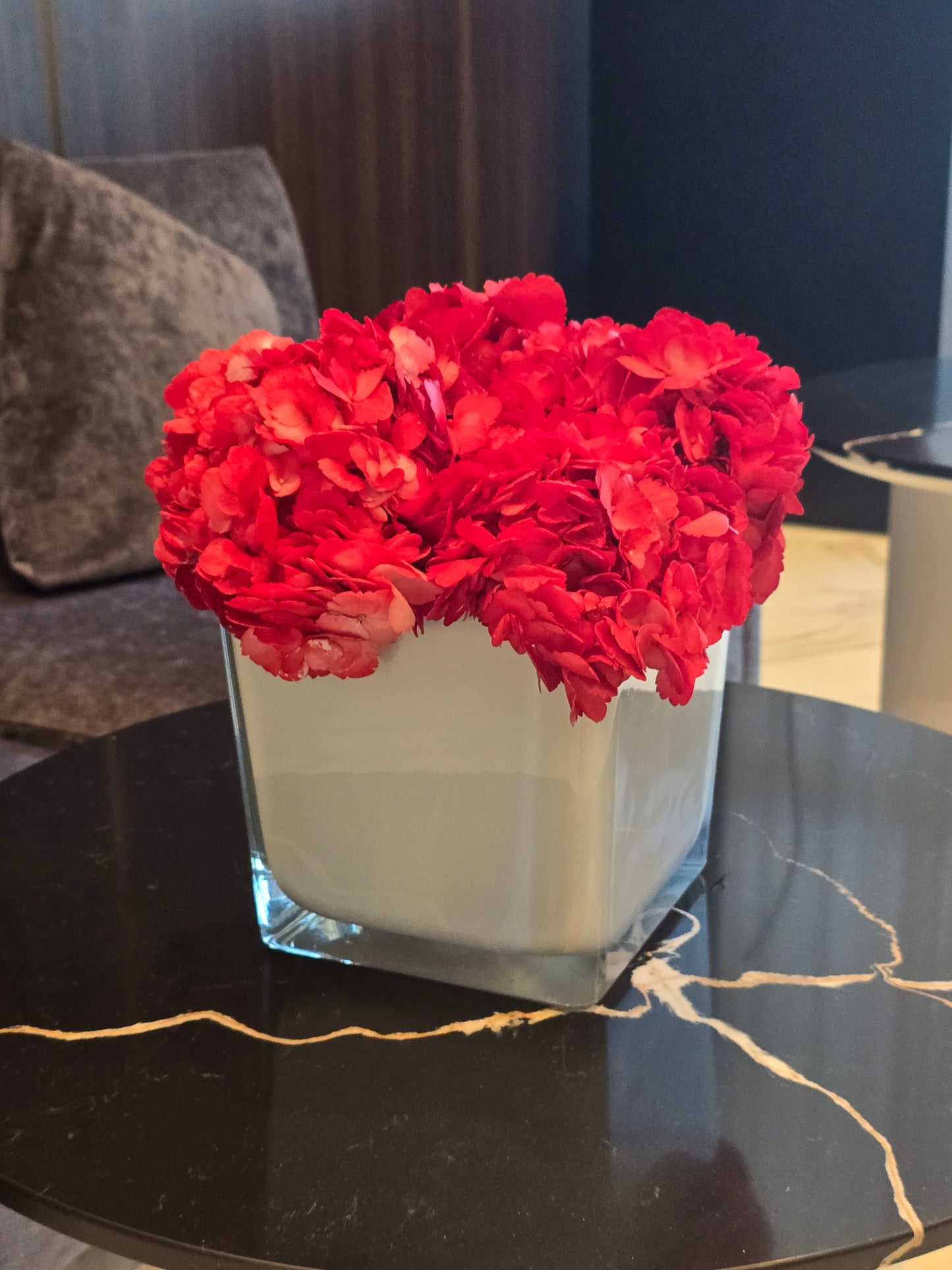 5 tinted hydrengea in a white solid vase